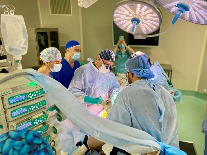 Doctors perform transplant surgery